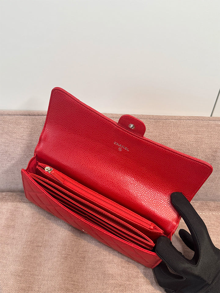 Interior of the preloved Chanel long wallet with a cardholder and a zipper pouch.