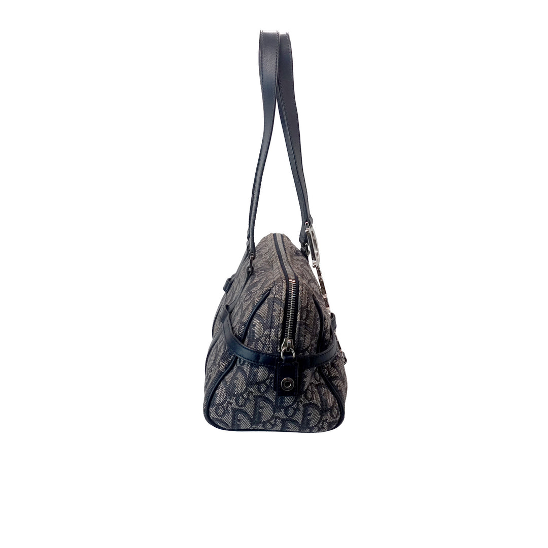 Left side of the Dior Vintage Oblique Bowling Bag in Navy Blue Canvas.