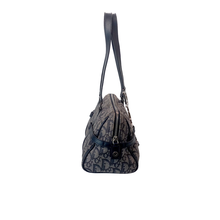 Left side of the Dior Vintage Oblique Bowling Bag in Navy Blue Canvas.