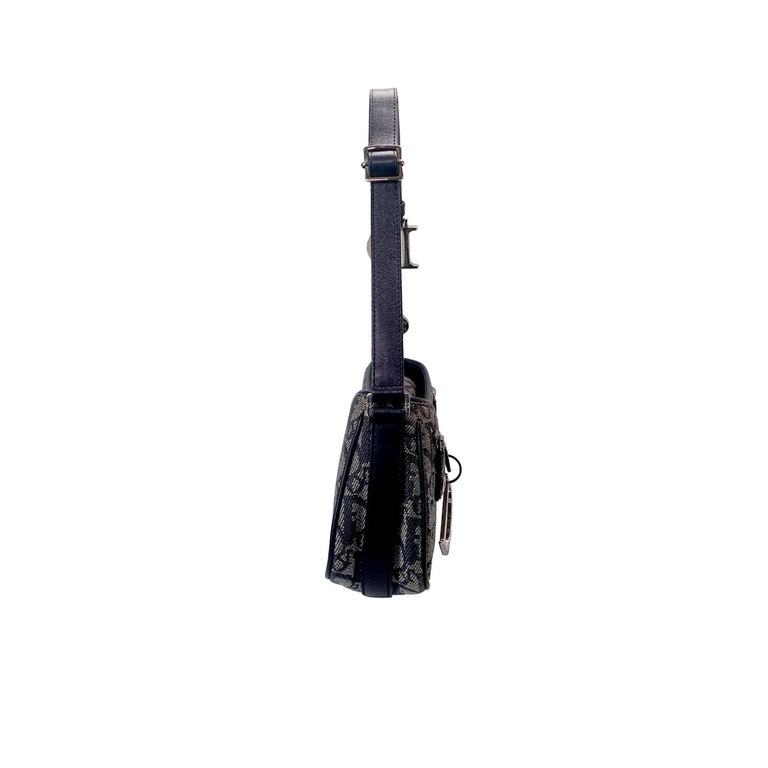 Left side of the Dior Vintage Oblique Trotter Baguette Bag with D Charm Navy Blue Canvas.
