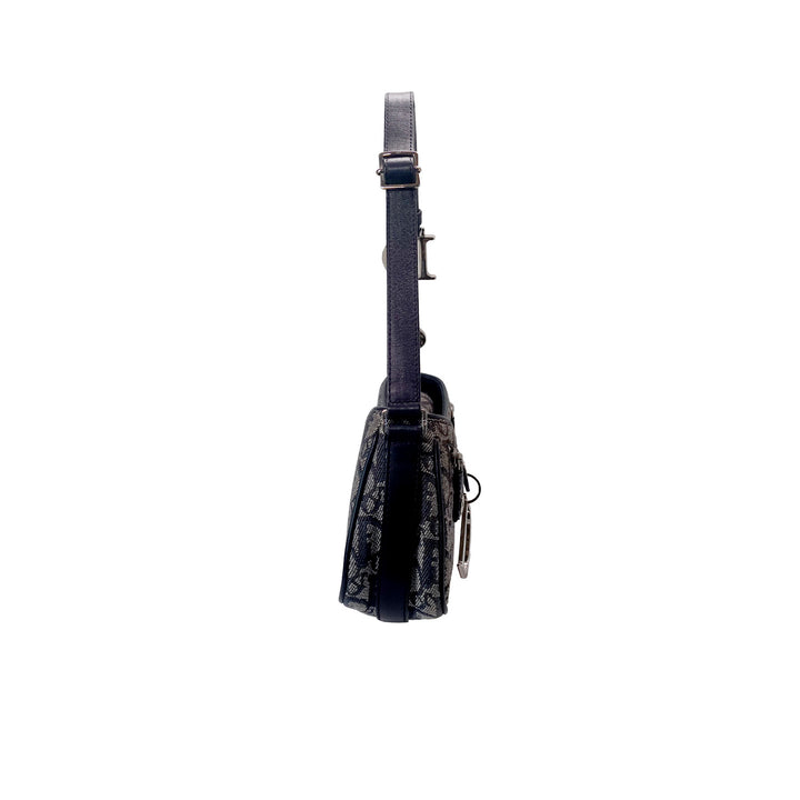 Left side of the Dior Vintage Oblique Trotter Baguette Bag with D Charm Navy Blue Canvas.