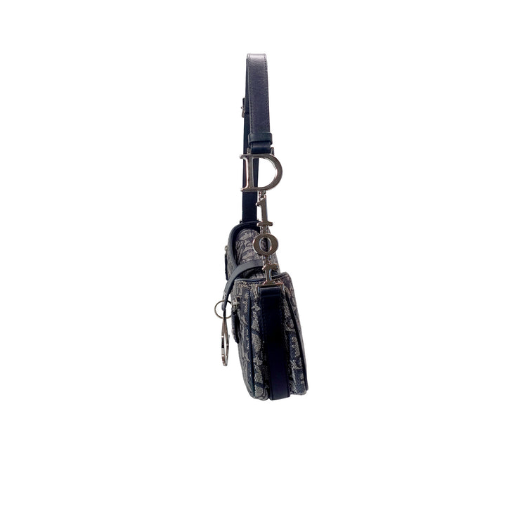 Right side of the Dior Vintage Oblique Trotter Baguette Bag with D Charm Navy Blue Canvas.