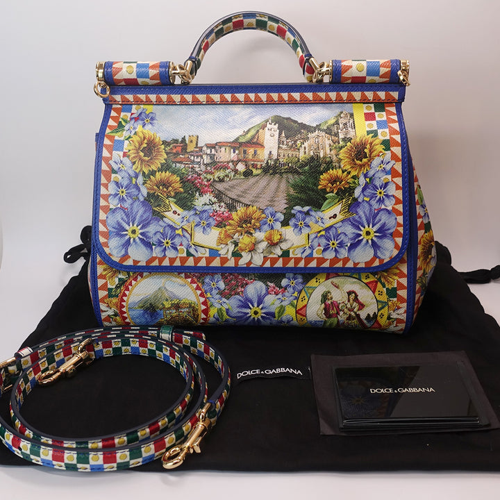 The handbag comes with the original Dolce & Gabbana dust bag, adjustable shoulder strap, and cards. 