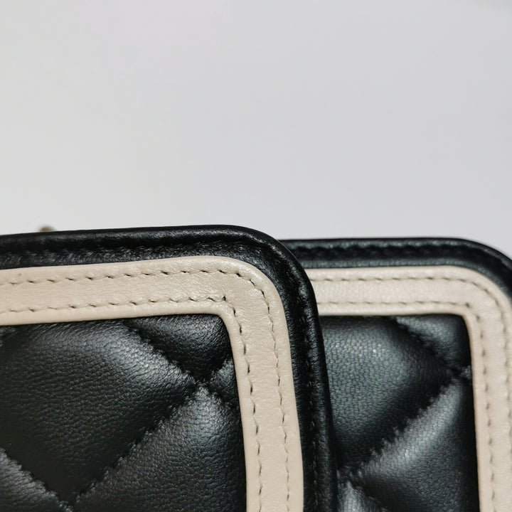 Chanel Wallet On Chain in Black Quilted Lambskin with Pink Trim