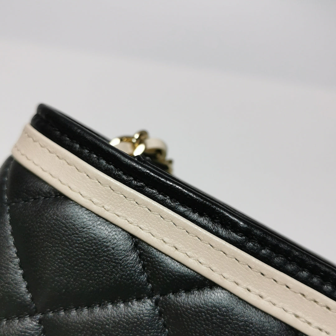 Chanel Wallet On Chain in Black Quilted Lambskin with Pink Trim