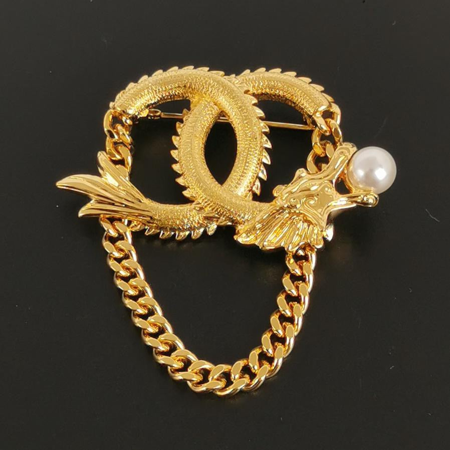Chanel 2024 Faux Pearl CC Lunar New Year Dragon Brooch