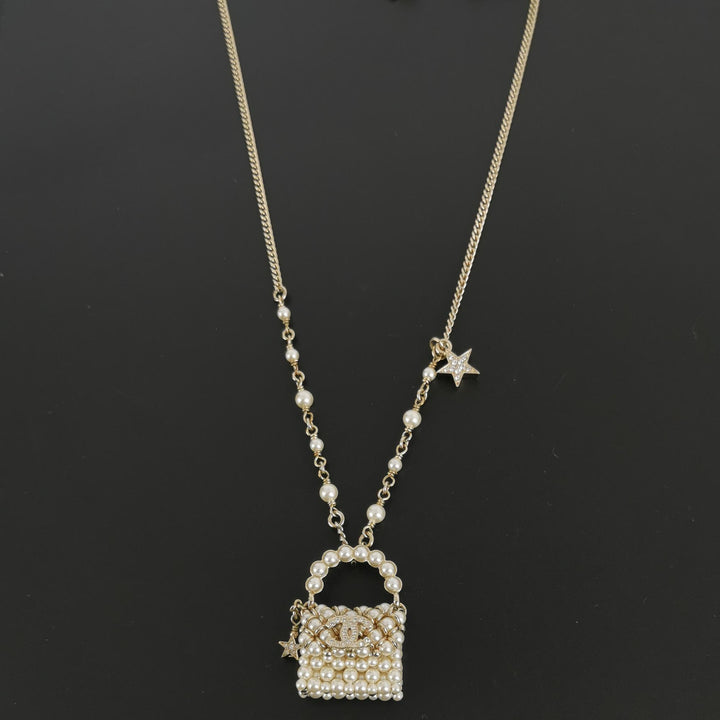 Chanel Little Bag Pendent Faux Pearl Necklace CC Logo