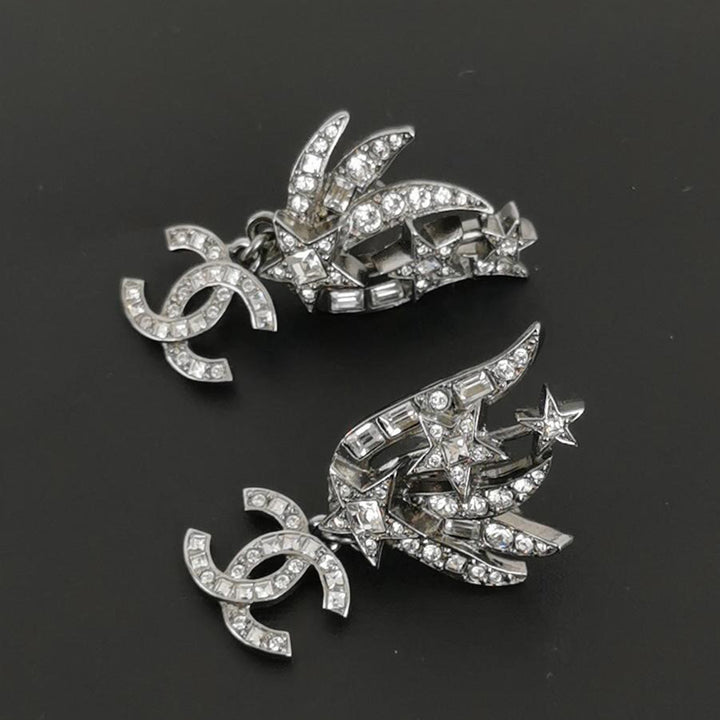 Chanel Crystal Baguette CC Wing Star Earrings Silver