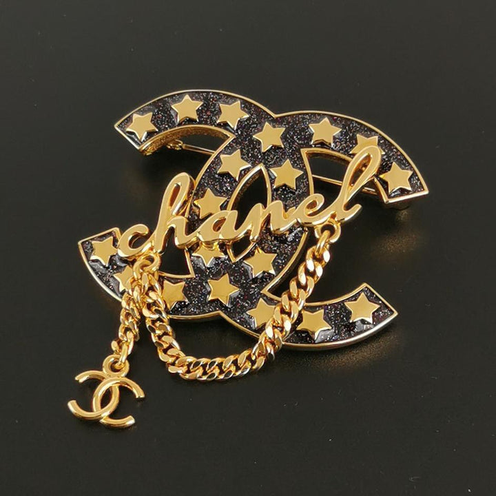 Chanel Metal Resin CC Star Chain Logo Brooch Gold Black