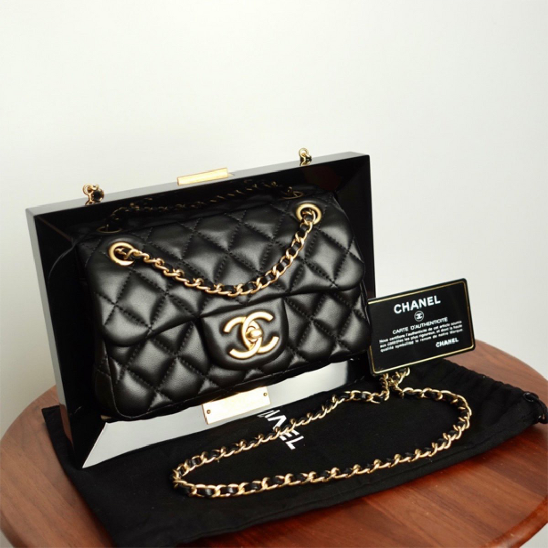 Chanel bag with gold plate on top sales