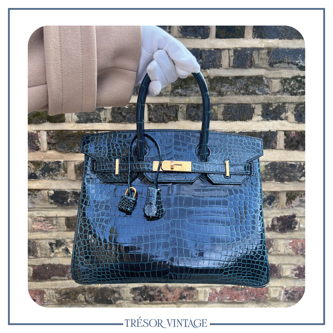 Showcasing the Hermès Vert Fonce Green Porosus Crocodile Leather Birkin 30.